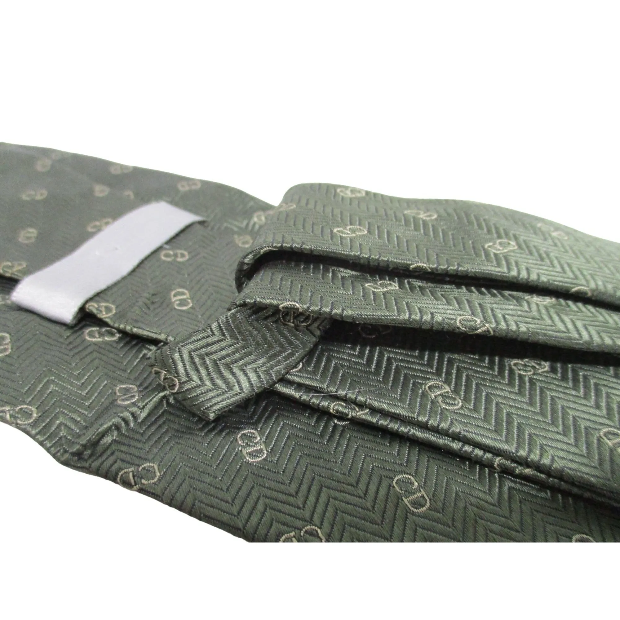 Vintage Christian Dior tie made of 100% textured, olive green silk with a logo print in shades of tan